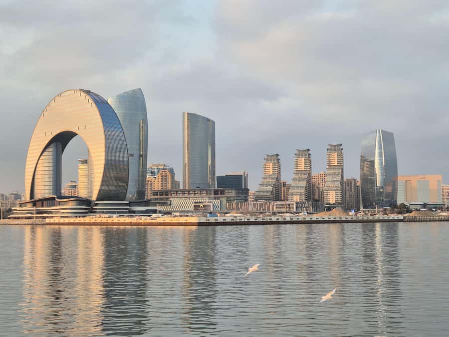 Baku: Caspian Sea Boat Tour with City Skyline Views - Flag Square, the giant flag, and the waterfront buildings