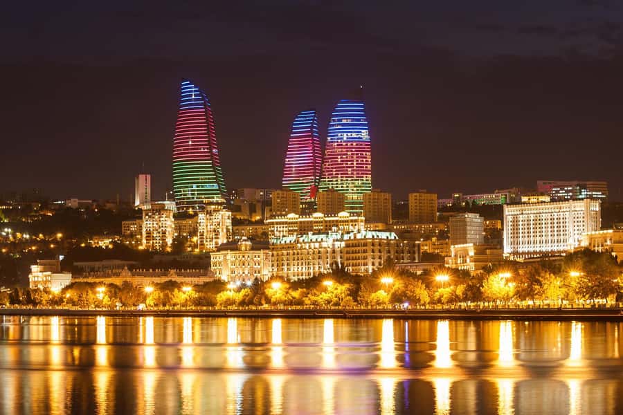 Baku Lights Night Tour with Hotel Pickup - Flag Square and Crystal Hall are seen from the road