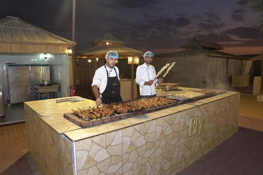 Dubai: Desert Safari, Camel Ride, Quad Bike & BBQ Dinner - Optional quad biking and what is not included